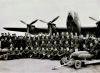 Sandy Grant, RAF WW2, with Lancaster bomber - 3rd from left in front row.  Likely in the Doncaster area.