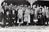 Maurice O'Donoghue Mabel Schaab wedding 1920 - guests on the veranda at Salisbury. Front row of standing adults: unidentified, Vic O'Donoghue, Pat Downie, Jack O'Donoghue, Aggie O'Donoghue, Chris O'Donoghue, unidentified, Mabel O'Donoghue as bride, Maurice O'Donoghue as groom, Sarah Schaab as bridesmaid, Norah O'Donoghue (mother of groom, wearing hat), Clara Schaab (mother of bride), unidentified, unidentified. Possibly Nancy O'Donoghue to right behind bridesmaid and possibly Mon O'Donoghue in wide hat behind bride and groom).  Unsure of which are Mick, Bill and Len O'Donoghue - if present. 